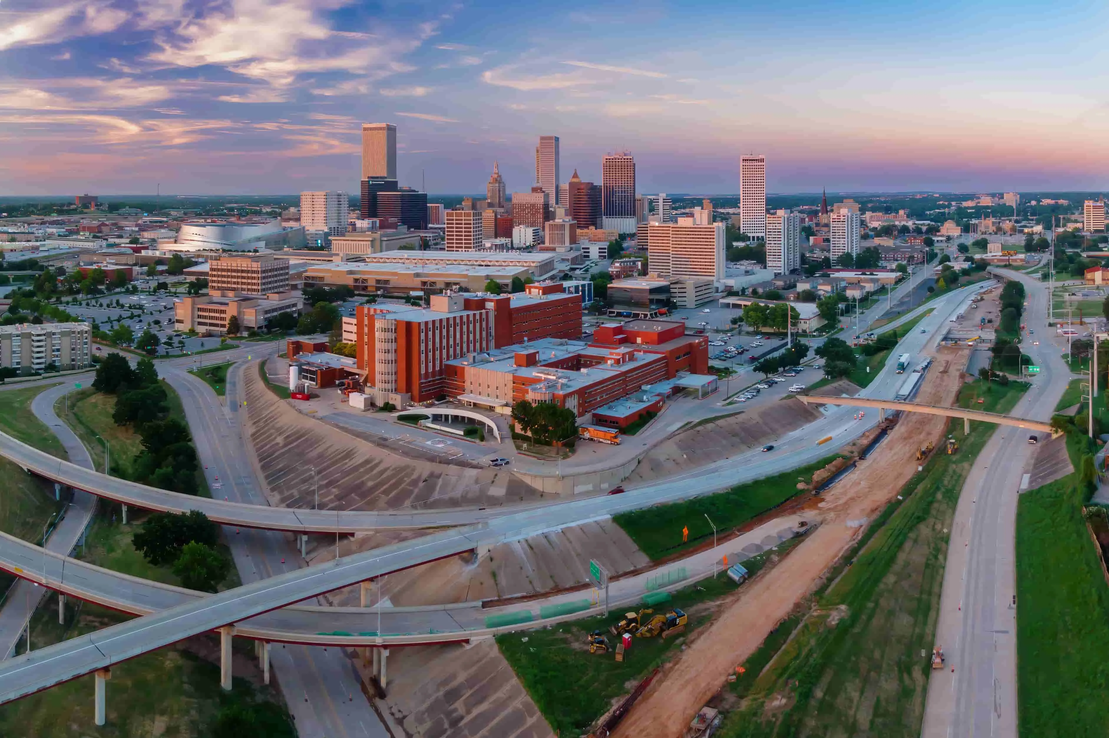 Freeway and downtown Tulsa city skyline at sunset, Oklahoma, United States